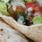 Falafel Plate With Pita, Israeli Salad And Hummus.