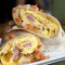 Hungriger Schinken-Frühstücks-Burrito