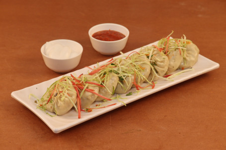 Steam Veg Momos 8 Pcs Served With Red Spicy Chutney Mevnies