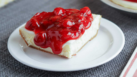 Cheesecake With Cherry Topping Slice