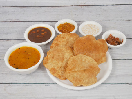 Aaloo Poori Aaloo Sabji, Chole, Kaddu, Raita And 4 Pooris