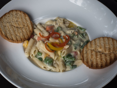 Herbed Vegetables In A Butter Garlic Sauce Fusilli Pasta.