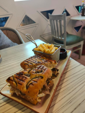 Rosemary And Olives Focaccia Sandwich With Chargrilled Chicken, Cheese, And Jalapenos