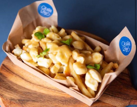 Canadian Poutine With A Soft Drink