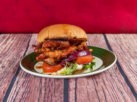 Juicy Jerk Chicken Thigh Burger On A Brioche Bun