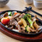 Sliced Beef With Black Pepper On Sizzling Plate