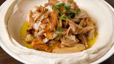Chicken Shawarma Over Hummus And Pita