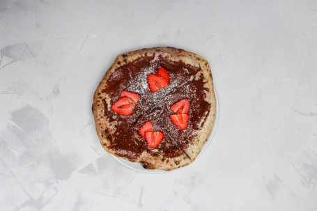 Nutella Pizza With Fresh Strawberries Icing Sugar