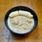 Peanut Butter Banana Porridge Served with Chia Seeds and Honey