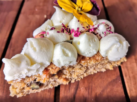 Slice Of Carrot And Pecan Nut Cake With Cream Cheese Frosting